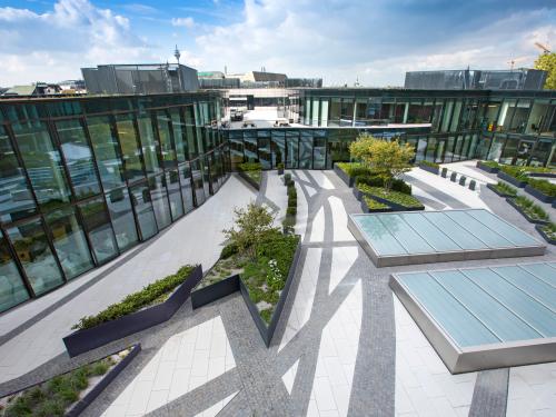 Courtyard with skylights, planters and paved areas